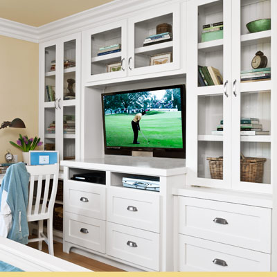 guest bedroom remodel with built-in maple and poplar storage cabinets for TV and drawers