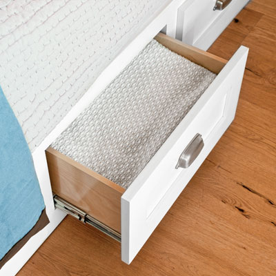 guest bedroom remodel with drawers in bed platform 