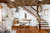 coastal cottage kitchen with wood plank walls, vintage-style details, built-ins and wood floors