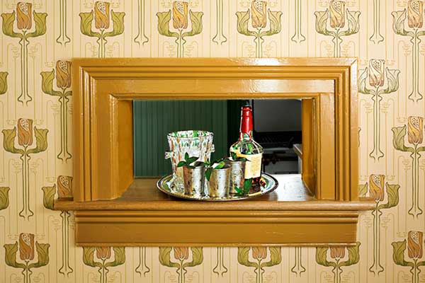 wall cutout that looks like window to serve as a wet bar