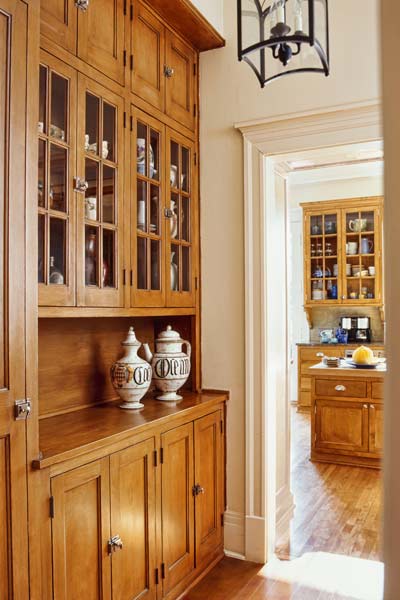 built-in storage unit in house's hallway used as wet bar