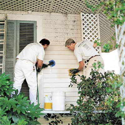 construction workers cleaning fiber cement siding