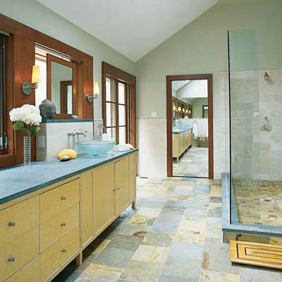 bathroom with blue stone countertop and multicolored floor tile