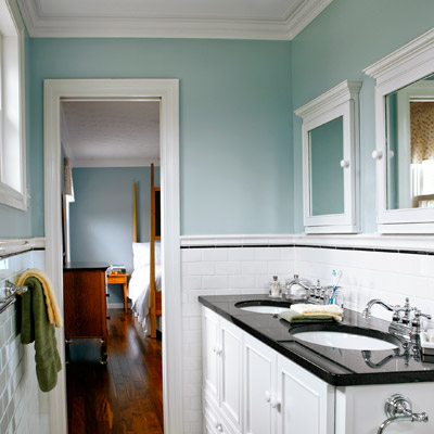 narrow small bathroom after remodel with his-and-hers sinks, blue walls