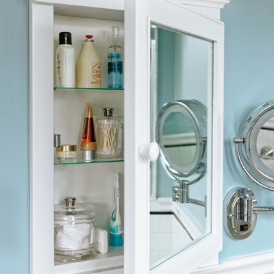 narrow small bathroom after remodel with custom medicine cabinets built and designed by the homeowner