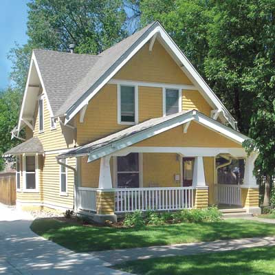 mustard yellow and white trim home with Craftsman features after makeover remodel