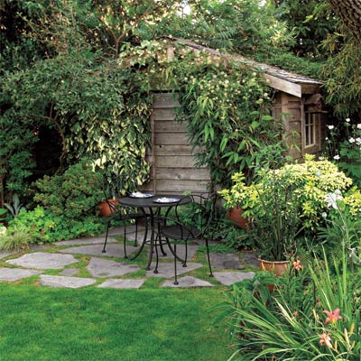 a patio with a lush arbor