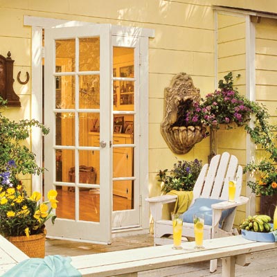 a deck with hanging ornaments on the exterior wall