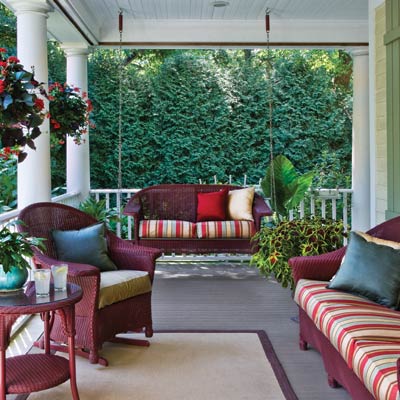 a porch with an evergreen screen