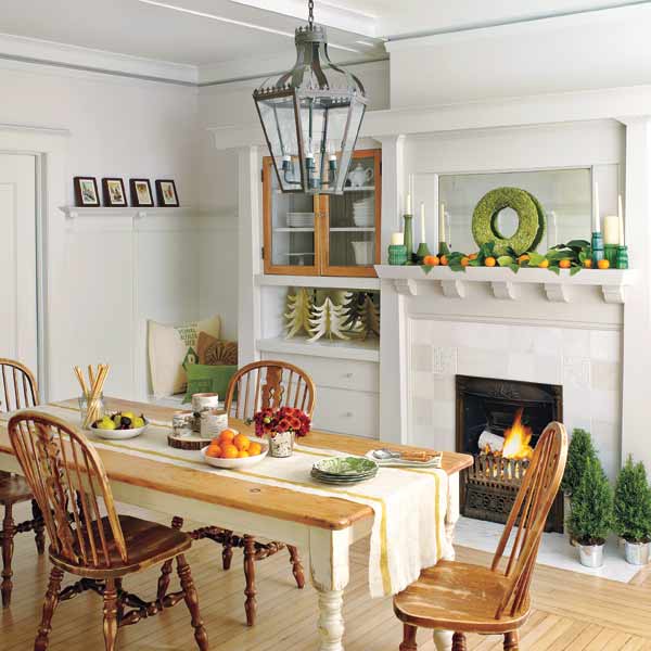 Christmas decorated dining room with lantern-style overhead light 