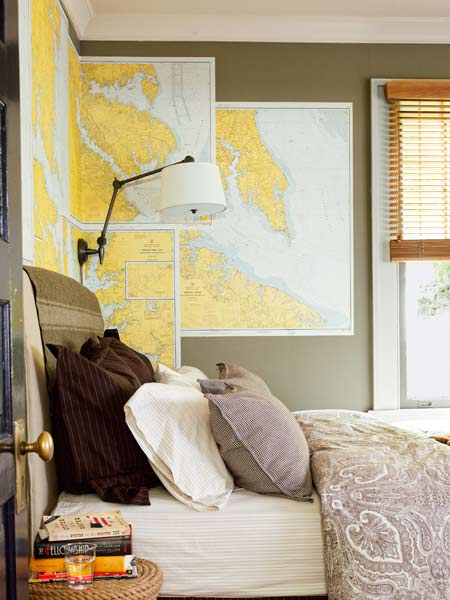 maps used as wall art in bedroom 