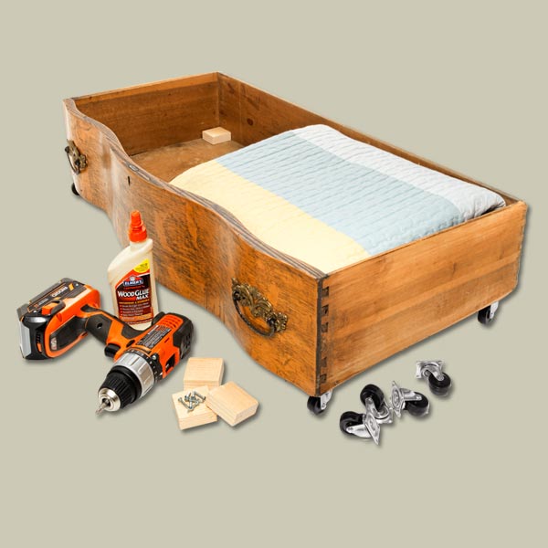 old dresser drawers repurposed as under-the-bed clothes storage containers