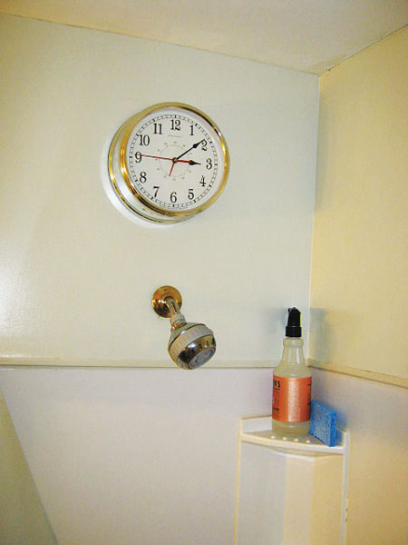 electric clock installed above a working shower head in a working shower in the this old house Home Inspection Nightmares XXVIII gallery