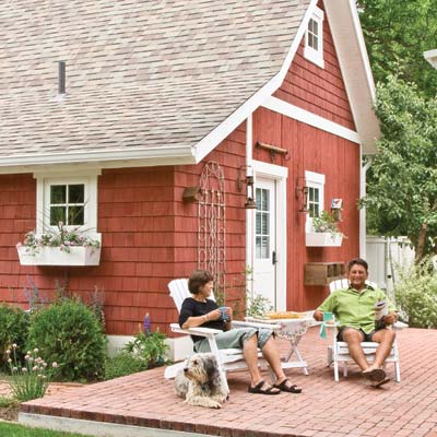 barn-style garage with paver patio in back 