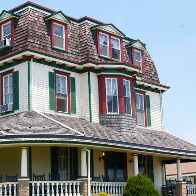 white home with green and red trim 