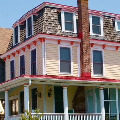 yellow house with red-orange trim 