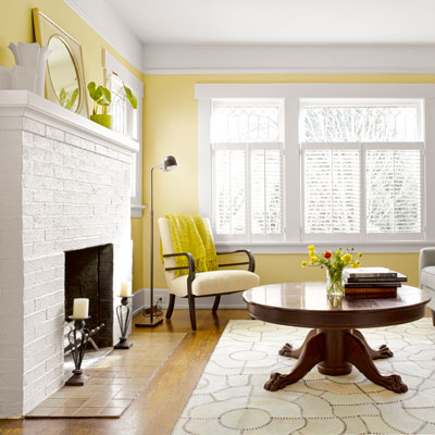 1918 craftsman bungalow after remodel living room with original leaded-glass windows, dark-stained floors 