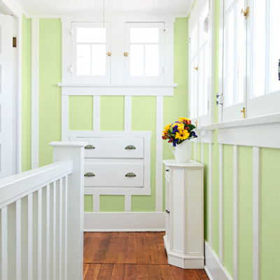 bungalow house upstairs landing with original balustrade and built-in drawers 