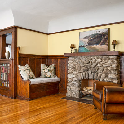 bungalow house living space with fireplace with stone surround 