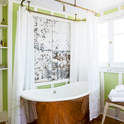 bungalow house second-floor bath with copper tub, salvaged-tin backsplash