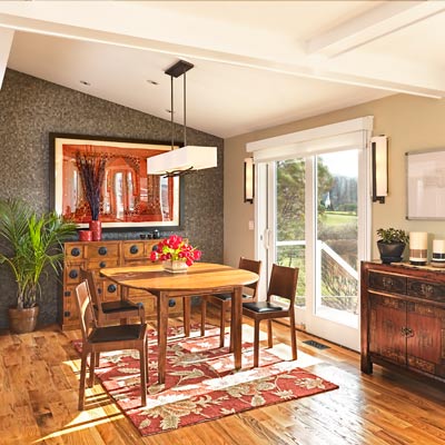 dining room with split-face bluestone tile wall and sliding glass doors to first-floor deck