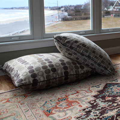 oversized, outdoor pillows in living room 