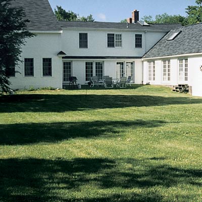 before backyard redo with outdoor furniture on grass by back of house