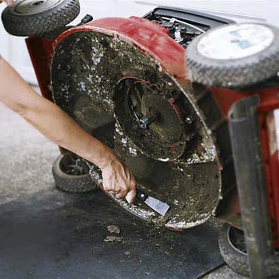 scraping lawn mower with putty knife