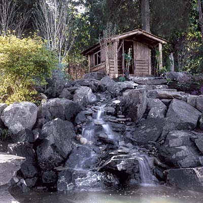 waterfall and cabin in Seattle front yard
