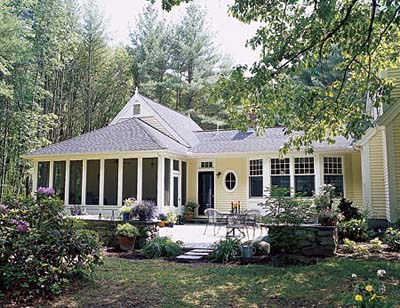 patio and outer yard separated by stone wall