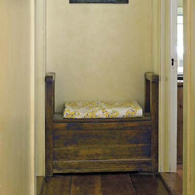 18th century bench, with storage space inside,  in the hallway
