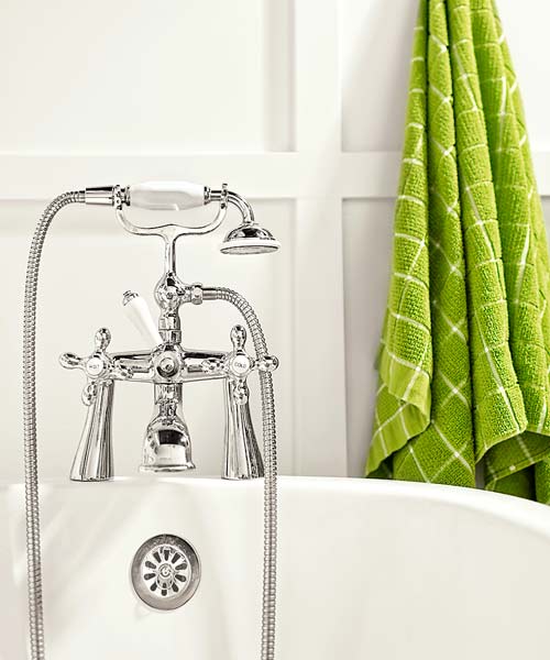 guest bath after redo with white on white paneled walls and soaking tub