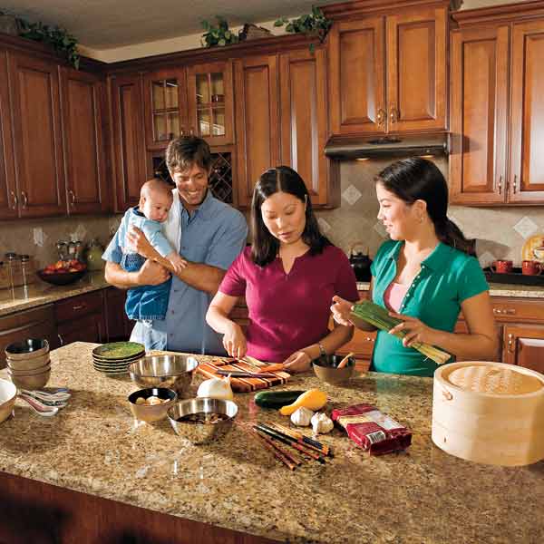all about stone countertops family in kitchen preparing food