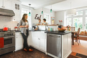 family in open kitchen after remodel