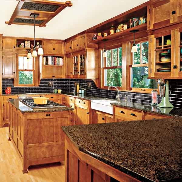 craftsman style kitchen with wood accents, open storage and cabinets up to dead space against ceiling