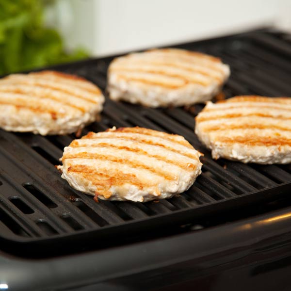 chicken patties grilling on indoor grill