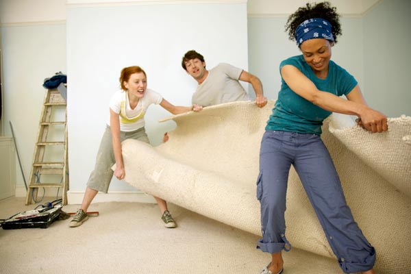 DIY calorie burners women and man ripping up old carpet