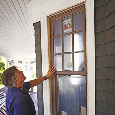 Tom Silva checks out a double-hung window