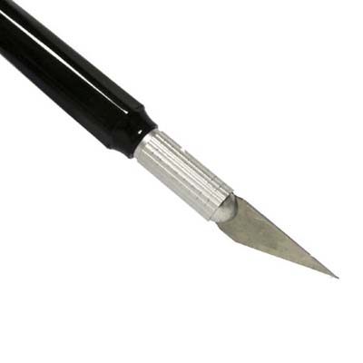 X-Acto Knife is used to detail and fit pieces together
