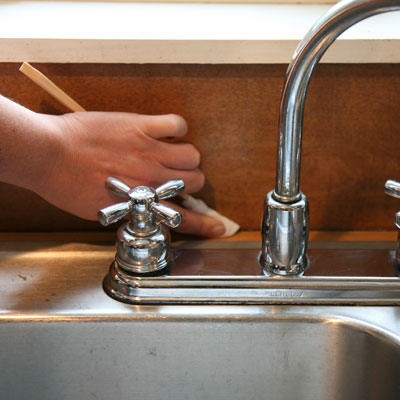 Chopsticks used to clean a sink faucet 