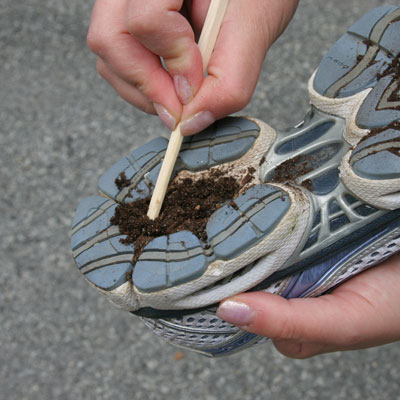 Chopsticks used to clean the bottom of a shoe
