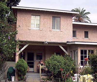 Pink stucco and no-frills backyard