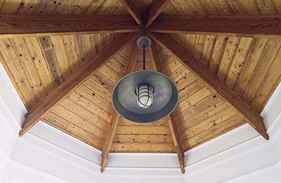 light fixture in octagonal tower of new Shingle-style house