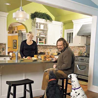 couple and their dogs in their newly remodeled kitchen