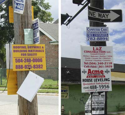 contractor signs on poles and trees in New Orleans