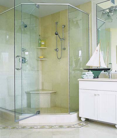 shower with glass doors and multiple showerheads
