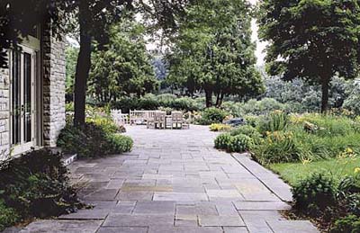 A screen of trees provides privacy.