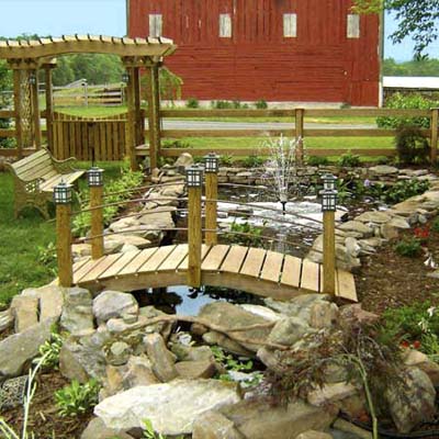 after photo of a back yard in Thurmond, MD with a fully developed pond