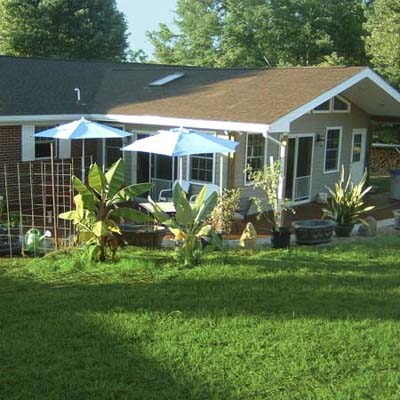 after photo of a back yard in Greeneville, TN with new patio and lush, green lawn