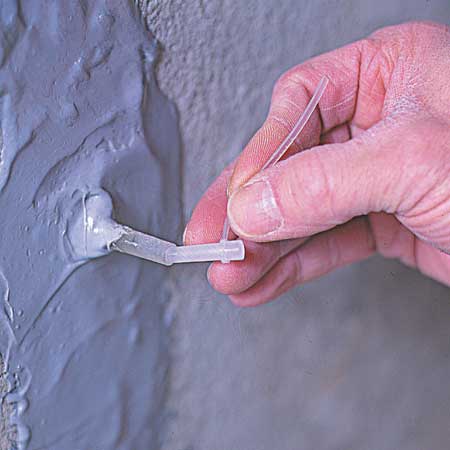 capping off the injection port with plastic plug